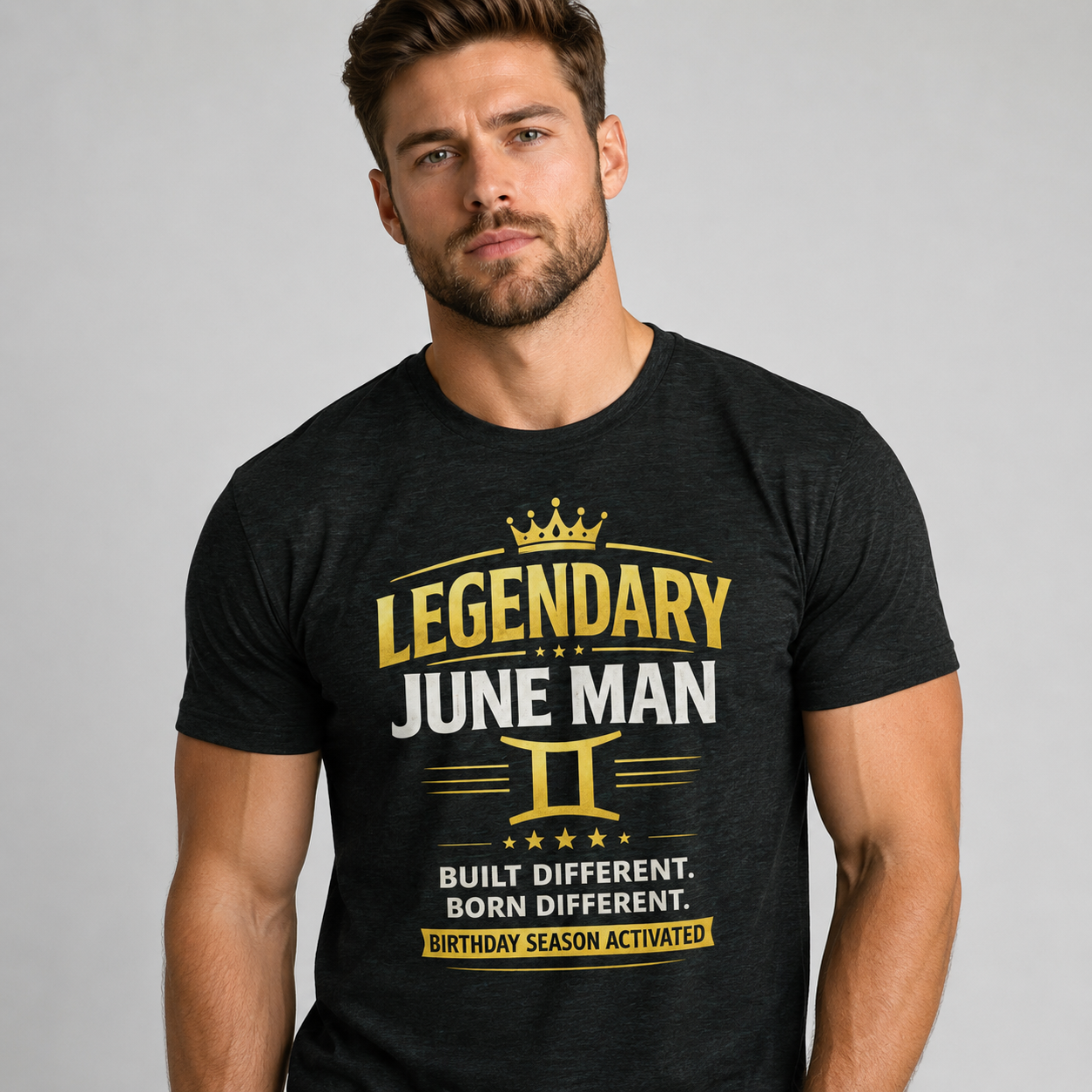 Man wearing a black t-shirt with 'Legendary June Man' design on a gray background