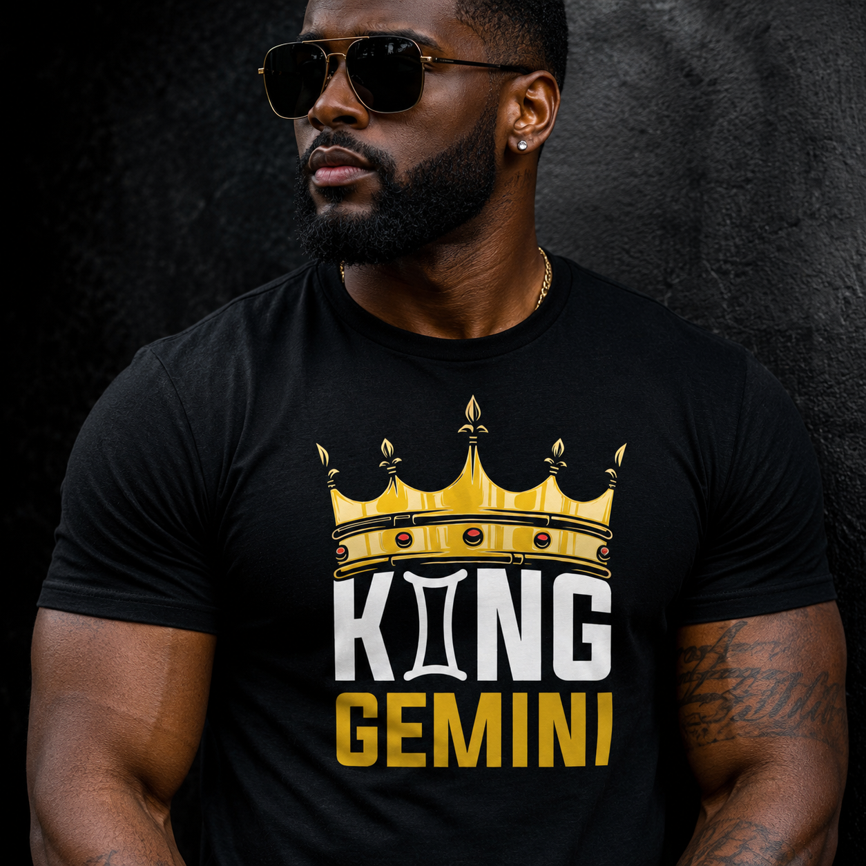 Man wearing a black t-shirt with 'King Gemini' design against a dark background